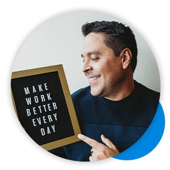 Headshot Quantum Workplace employee holding a letter board that says make work better every day.